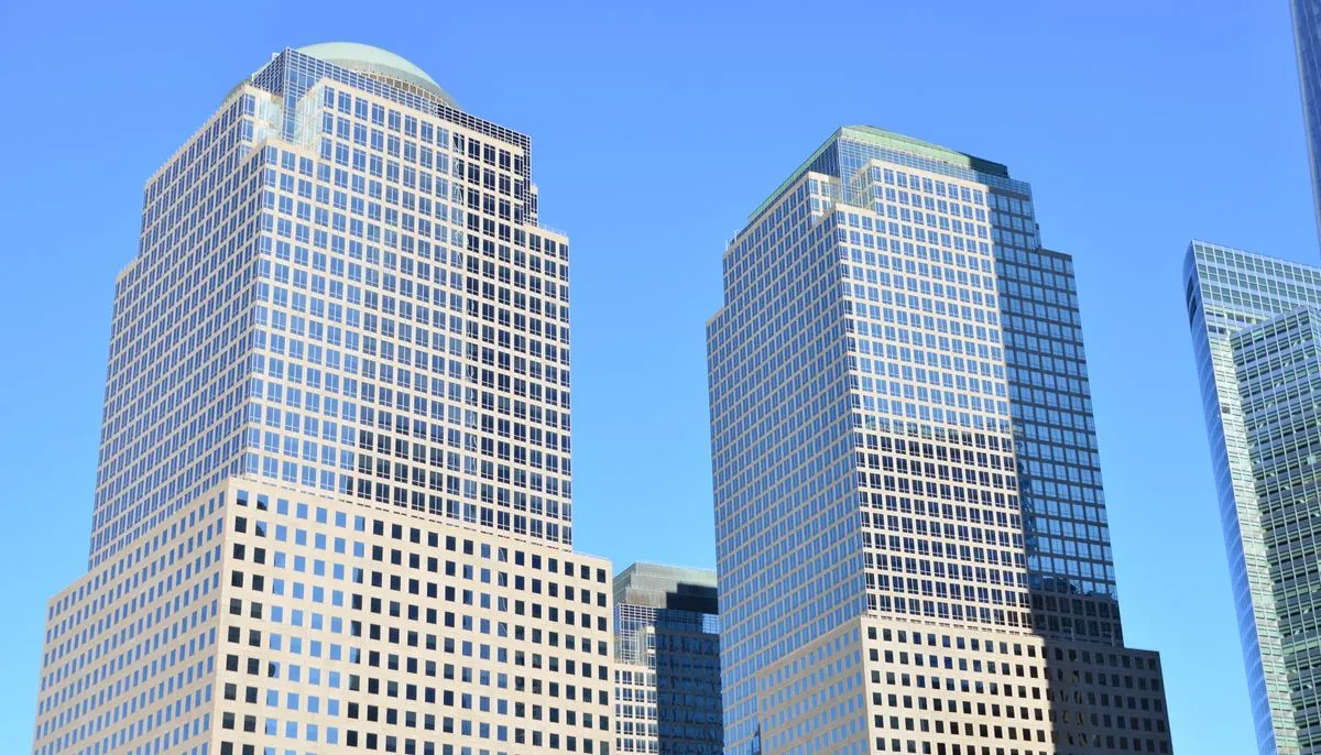 Modern glass skyscrapers against blue sky