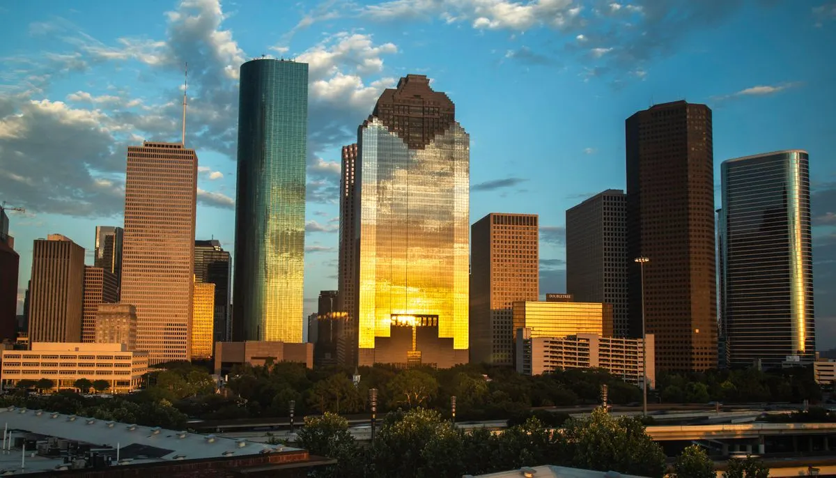 High rise buildings in the city under the cloudy sky