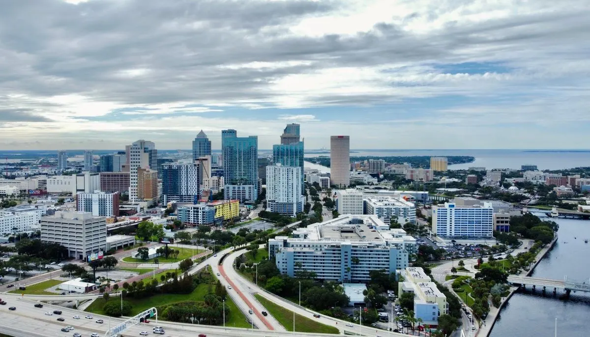 Aerial view of city buildings near body of water