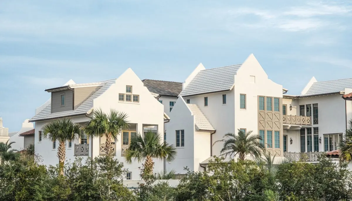 Palm trees by houses