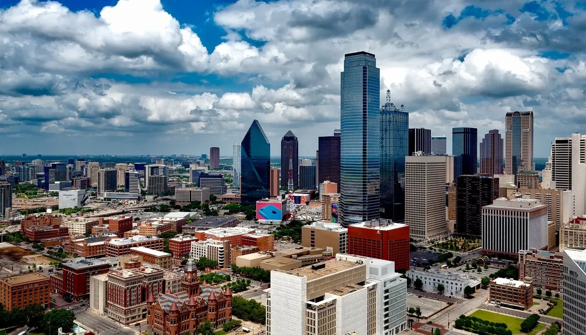 Aerial photo of city under white clouds