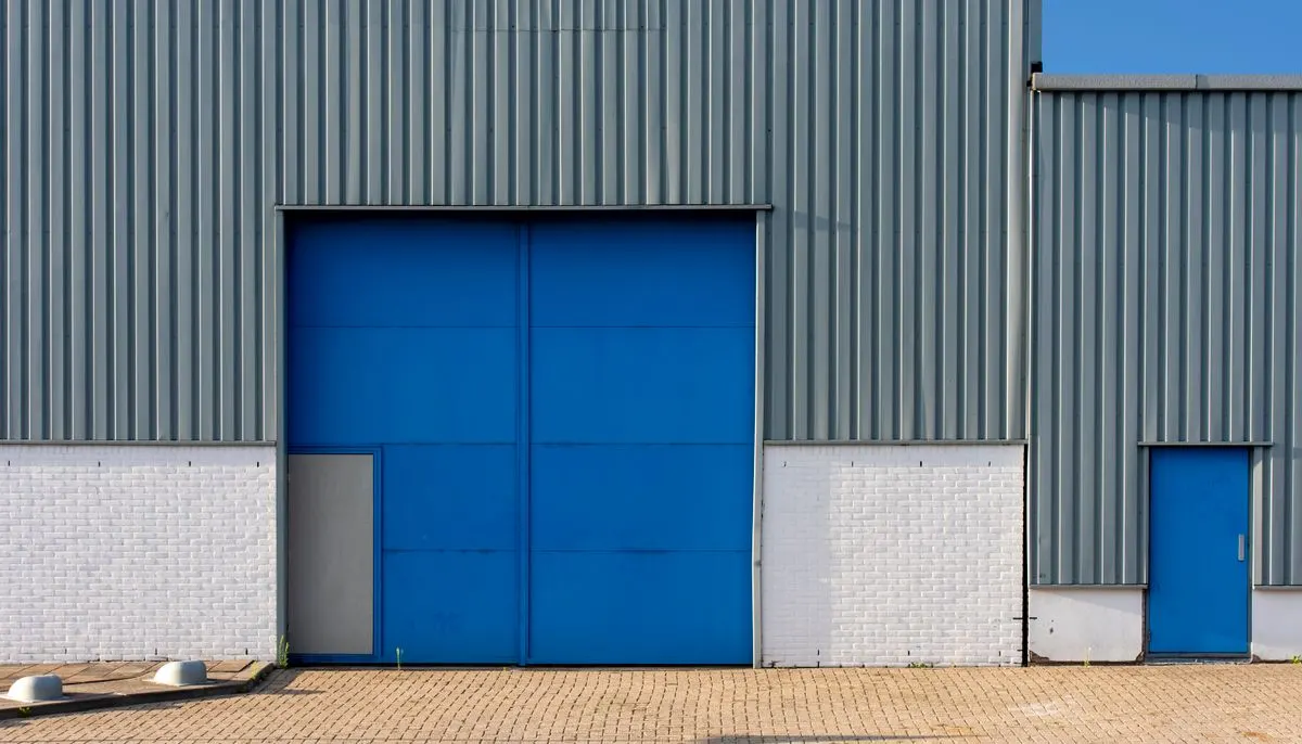 Industrial blue metal warehouse exterior facade
