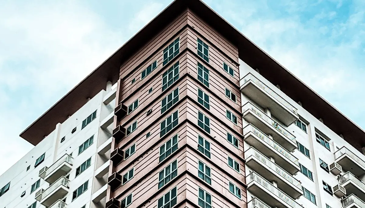 Modern urban condo against blue sky
