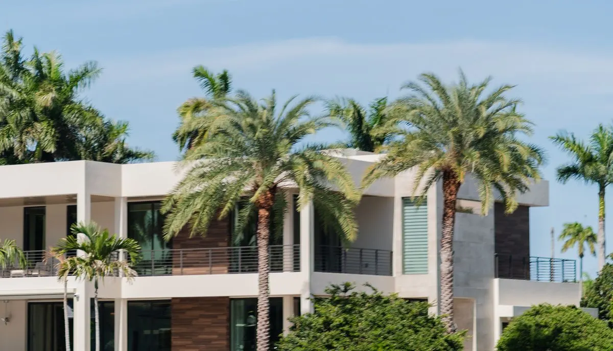 Luxury waterfront villa with palm trees