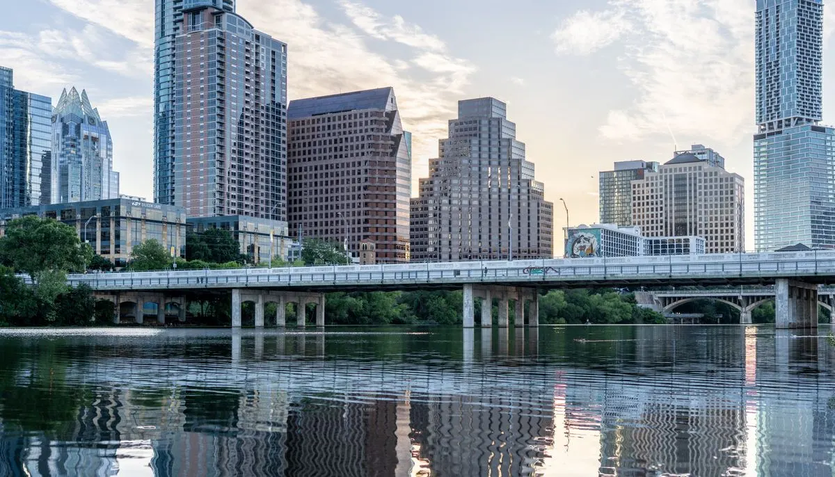 Austin skyline reflected in lady bird lake at daybreak
