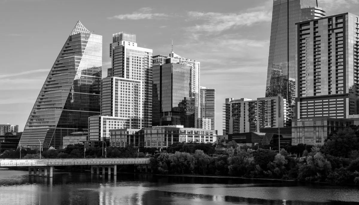 Modern austin skyline reflects on water