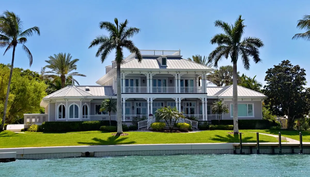 Luxurious waterfront villa with palm trees