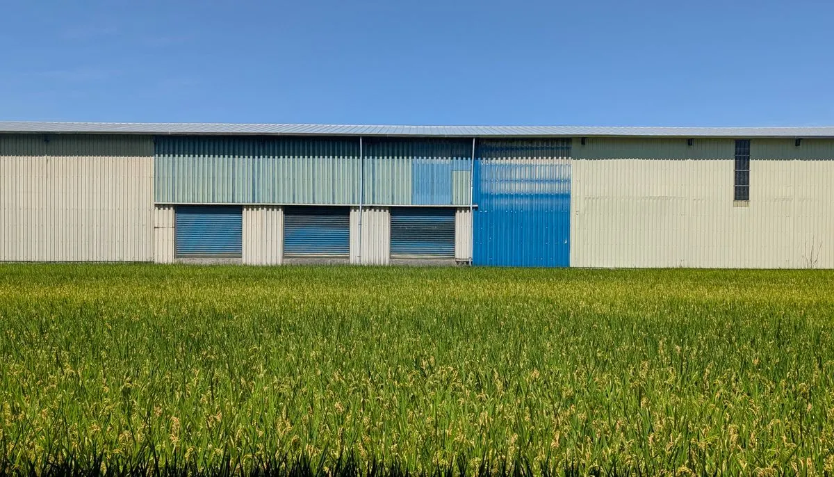 Warehouse facade with blue doors and sky