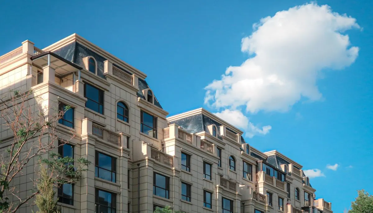 Elegant urban apartment building under blue sky