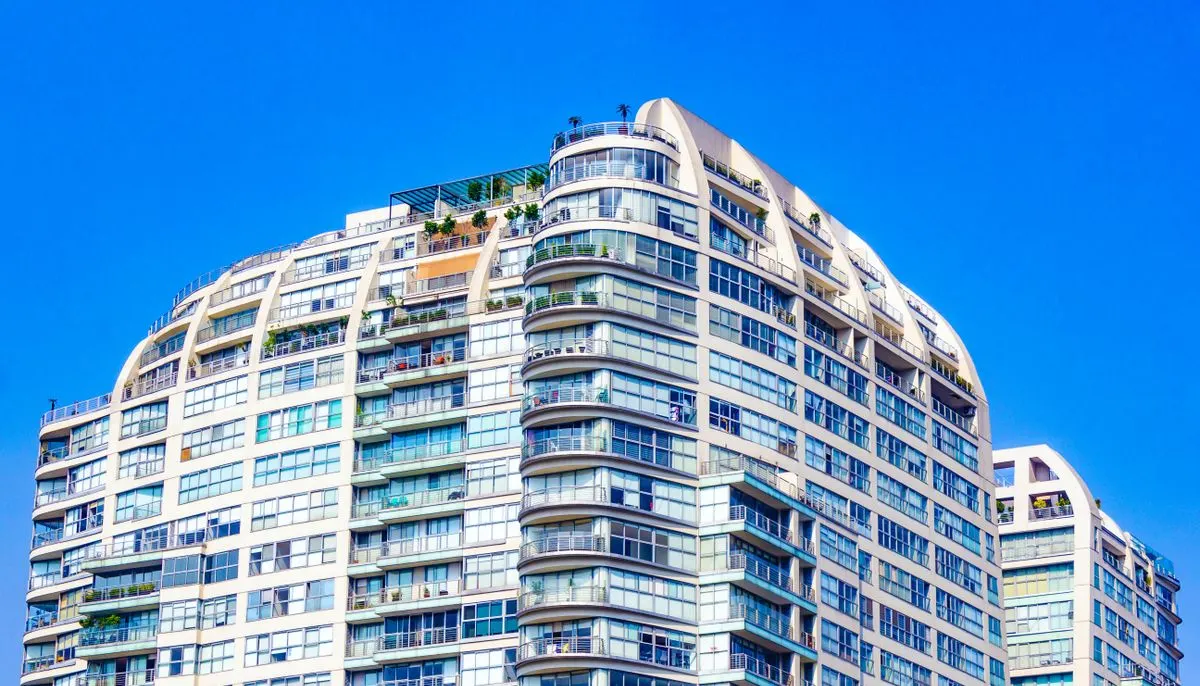 Contemporary residential complex against clear blue sky