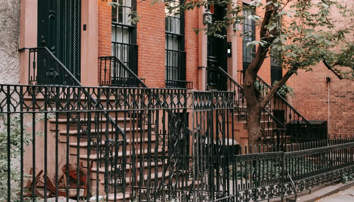 Contemporary brick house enclosed with fence