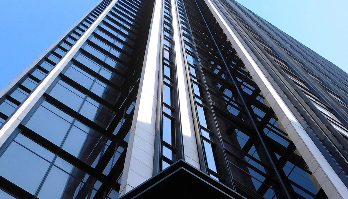 Skyscraper facade with glass walls and windows