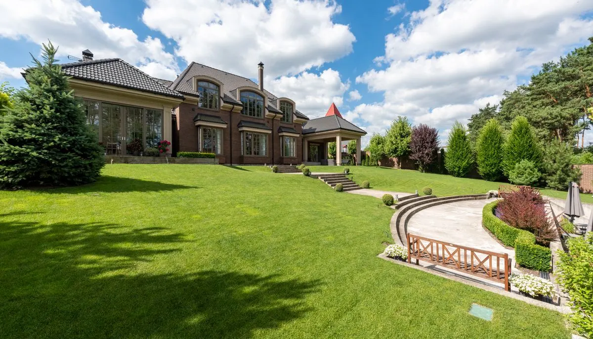 Lawn and steps in front of a mansion